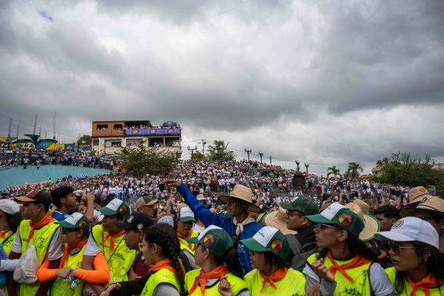 Faithfuls attend the annual procession of Divina Pastora in Barquisimeto, Venezuela on January 14, 2026. (Photo by Maryorin Mendez / AFP)