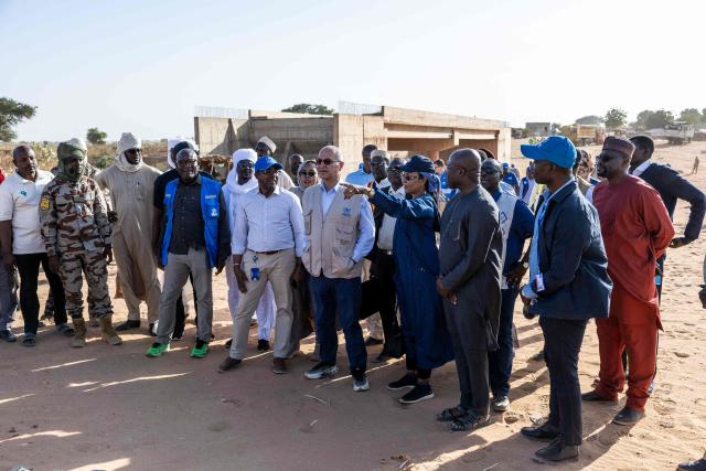 United Nations (UN) High Commissioner for Refugees, Barham Salih (C) arrives at the Sudanese border, in Adre, Ouaddai, on January 14, 2026. (Photo by Joris Bolomey / AFP)