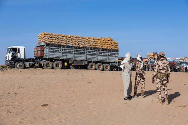 Chadian soldiers guard the border with Sudan, where trucks are stationed, in Adre, Ouaddai, on January 14, 2026. (Photo by Joris Bolomey / AFP)