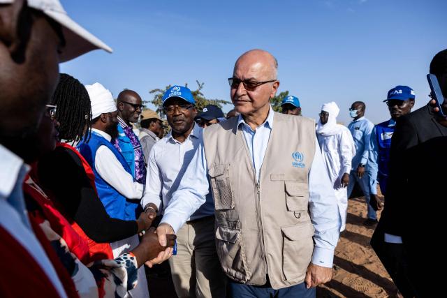 United Nations (UN) High Commissioner for Refugees, Barham Salih (C) greets members of NGO's in Adre, Ouaddai, on January 14, 2026. (Photo by Joris Bolomey / AFP)