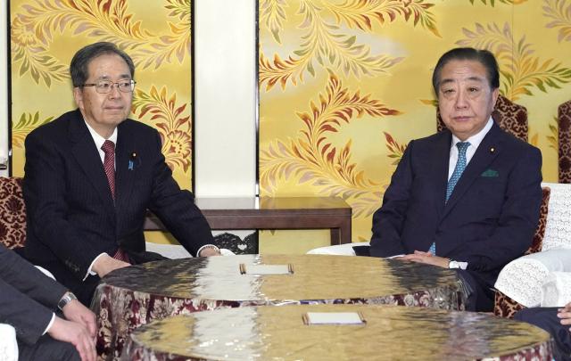 Leader of the Constitutional Democratic Party of Japan (CDP) Yoshihiko Noda (R) and Komeito leader Tetsuo Saito attend a meeting at the National Diet in Tokyo on January 15,2026. Top officials from the largest opposition Constitutional Democratic Party of Japan (CDP) and Komeito -- the ruling Liberal Democratic Party's former coalition partner -- agreed to form a new "centrist" counterforce, CDP leader Yoshihiko Noda told reporters. (Photo by JIJI PRESS / AFP) / Japan OUT