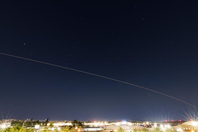 In a 103 second long exposure image the SpaceX Dragon capsule Crew 11 returns early to Earth from space due to an astronauts medical issue as seen during reentry over Los Angeles, California on January 15, 2026 carrying four International Space Station (ISS) NASA astronauts Mike Fincke and Zena Cardman, Japan Aerospace Exploration Agency (JAXA) astronaut Kimiya Yui, and Roscosmos cosmonaut Oleg Platonov. Four crewmembers departed the International Space Station on January 14 after a medical issue prompted their mission to be cut a month short -- a first for the orbiting laboratory. The US space agency has declined to disclose which crewmember has the health problem or give details about the issue, but it has stressed the return is not an emergency situation. The affected crewmember "was and continues to be in stable condition," NASA official Rob Navias said on January 14. (Photo by Patrick T. Fallon / AFP)