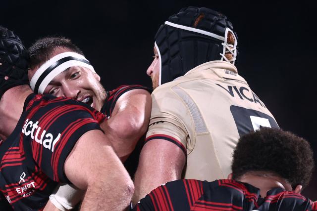 (FILES) Toulouse's French number eight Alexandre Roumat drives the maul during the French Top14 rugby union match between Lyon Olympique Universitaire Rugby and Stade Toulousain Rugby (Toulouse) at the Gerland Stadium in Lyon, central-eastern France on December 20, 2025. Facing a season start where he was struggling to "find enjoyment," Toulouse number eight Alexandre Roumat is now "able to take a step back," at 28, thanks to his experience as an international player, as the Tournament approaches, he told AFP. (Photo by Alex MARTIN / AFP)