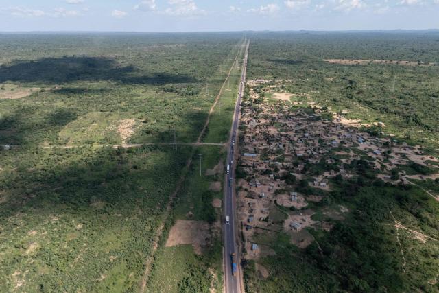 This aerial view shows road in a forest area in Likasi on November 27, 2025. As Chinese, US and other companies jostle over DR Congo’s critical minerals, communities in Haut-Katanga province fear security restrictions or unannounced road constructions in reserves will increase as they seek to protect their land. (Photo by Glody MURHABAZI / AFP)