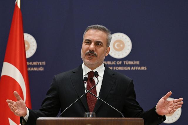 Turkish Minister of Foreign Affairs Hakan Fidan addresses the audience during a press briefing meeting to review the past year and to share insights regarding regional and global developments in Istanbul, on January 15, 2026. Turkey's top diplomat called on January 15, 2026 for dialogue to the crisis in Iran, rocked by mass protests which rights group say have left thousands dead and which prompted US warnings to Tehran. (Photo by Ozan KOSE / AFP)