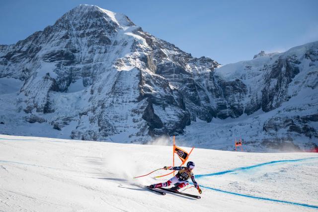 France's Maxence Muzaton skies down as the Jungfrau mountain is seen in the background during the men's Downhill training at the FIS Alpine Skiing World Cup in Wengen on January 15, 2026. (Photo by Fabrice COFFRINI / AFP)