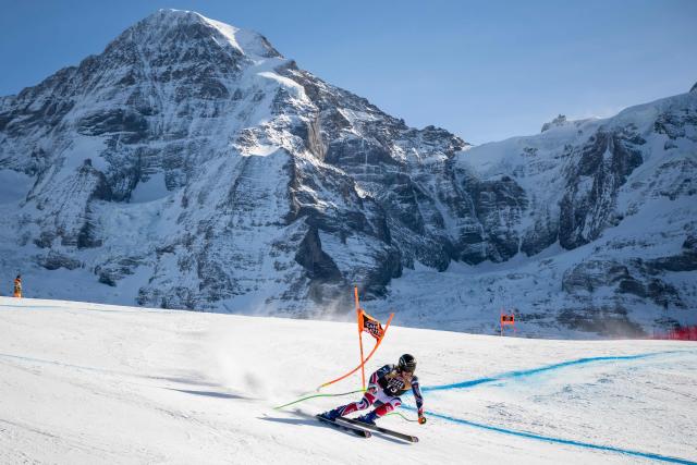 France's Nils Allègre skies down as the Jungfrau mountain is seen in the background during the men's Downhill training at the FIS Alpine Skiing World Cup in Wengen on January 15, 2026. (Photo by Fabrice COFFRINI / AFP)