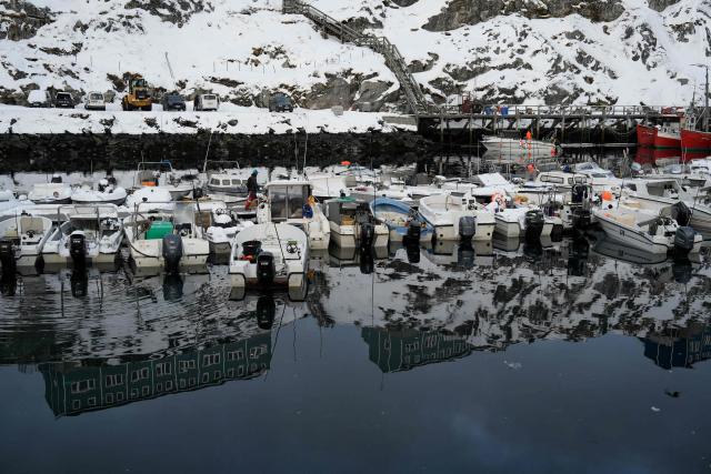 Boats are moored in the harbour in Nuuk, Greenland, on January 15, 2026. Denmark's prime minister said on January 15, 2026 that the US ambition to take control of Greenland remained "intact" and that there were still a "fundamental disagreement" between the countries, despite high-stakes White House talks. (Photo by Alessandro Rampazzo / AFP)