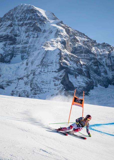 France's Blaise Giezendanner skies down as the Jungfrau mountain is seen in the background during the men's Downhill training at the FIS Alpine Skiing World Cup in Wengen on January 15, 2026. (Photo by Fabrice COFFRINI / AFP)