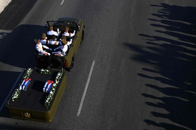 One jeep of the funeral procession carrying the remains of the 32 Cuban soldiers who died during the US incursion to capture Venezuelan leader Nicolas Maduro rides on Boyeros Avenue in Havana on January 15, 2026. The capture by US forces of Venezuelan leader Nicolas Maduro on January 3, 2026, and the killing in the operation of 32 Cubans assigned to protect him represent a major blow for the island's revered intelligence services, experts say. (Photo by Yamil LAGE / AFP)