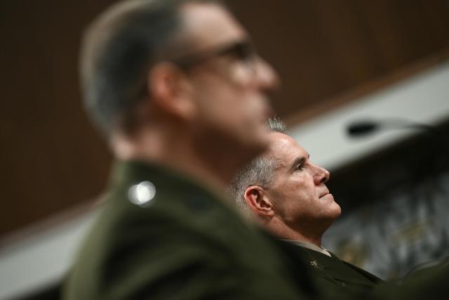 (L/R) US Marine Corps Lt. Gen. Francis L. Donovan, nominee for Commander of US Southern Command, and US Army Lt. Gen. Joshua M. Rudd, nominee for Director of the National Security Agency, Chief of Central Security Service, and Command of US Cyber Command, take their seats as they arrive for a Senate Committee on Armed Services hearing on their nominations on Capitol Hill in Washington, DC, on January 15, 2026. (Photo by Brendan SMIALOWSKI / AFP)