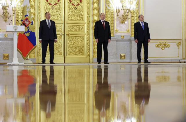 Russia's President Vladimir Putin, Foreign Minister Sergei Lavrov and presidential aide Yury Ushakov attend a ceremony to receive letters of credence from newly appointed foreign ambassadors at the Grand Kremlin Palace in Moscow on January 15, 2026. (Photo by Ramil Sitdikov / POOL / AFP)