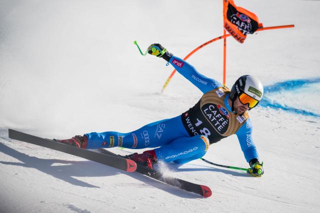 Italy's Florian Schieder skies down as the Moench mountain is seen in the background during the men's Downhill training at the FIS Alpine Skiing World Cup in Wengen on January 15, 2026. (Photo by Fabrice COFFRINI / AFP)