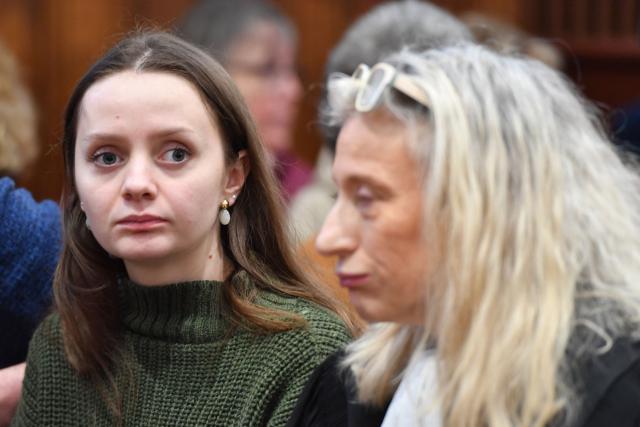 Chloe P. (L0 sits next to her lawyer Isabelle Steyer (R), at the courthouse after the trial of her ex-companion before the Loir-et-Cher Assize Courthouse in Blois, central France on January 15, 2026, after he violently attacked her in December 2022. On December 13, 2022, the young woman, then 24 years old, went to the Blois police station to file a complaint against her ex-partner. But on the spot, Chloé P., a manager in a pizzeria, was invited by the police officer to come back the next day. She was found two hours later by the police, alerted by neighbors, left for dead in a pool of blood, in the middle of the common areas of her building. (Photo by JEAN-FRANCOIS MONIER / AFP)