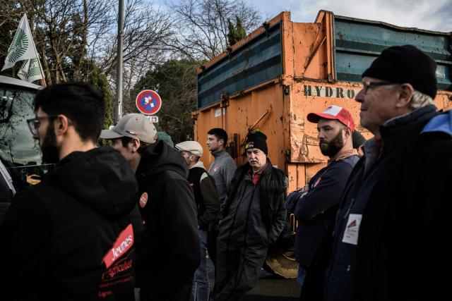 Farmers listen to a speech during a protest against the EU-Mercosur trade deal in Lyon on January 15, 2026. (Photo by JEFF PACHOUD / AFP)