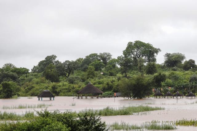 A general view floodwaters at Axivaleni Resort at the Nsami dam, in Giyani on January 15, 2026. Flooding triggered by torrential rains in northeastern South Africa claimed at least 10 lives overnight and forced the closure of the iconic Kruger National Park, officials said on January 15, 2026. 
The weather service issued the maximum warning for more rain in parts of the country while neighbouring Mozambique was also on alert after flooding that inundated roads and homes. (Photo by Orlando Chauke / AFP)