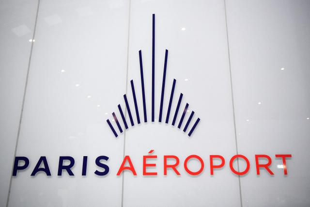 (FILES) A logo of the "Aeroport de Paris" (Groupe ADP) is photographed at the Paris-Charles-de-Gaulle airport in Roissy, outside Paris, on January 1, 2023. Passenger traffic at Paris Airports has gone up 3.4% in 2025, just below pre-Covid levels, the Aeroports de Paris group announced in a press release on January 15, 2026. (Photo by JULIEN DE ROSA / AFP)