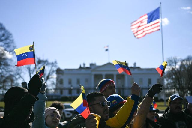 Supporters of Venezuela gather outside the White House ahead of the meeting between US President Donald Trump Venezuelan opposition leader Maria Corina Machado in Washington, DC on January 15, 2026. (Photo by Brendan SMIALOWSKI / AFP)