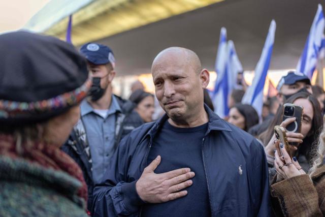Former Israeli prime minister Naftali Bennett joins a rally supporting the Israeli military draft and calling for ultra-Orthodox Jews to enlist for military service, in Jerusalem on January 15, 2026. A new draft law on conscripting ultra-Orthodox Jews, whose support is crucial for Prime Minister Benjamin Netanyahu's government, has sparked uproar in Israel, with the opposition denouncing it as a special privilege for "draft-dodgers". Under a ruling established at the time of Israel's creation in 1948, men who devote themselves full-time to studying sacred Jewish texts are given a de facto pass from mandatory military service. The ultra-Orthodox make up 14 percent of Israel's Jewish population. (Photo by ILIA YEFIMOVICH / AFP)