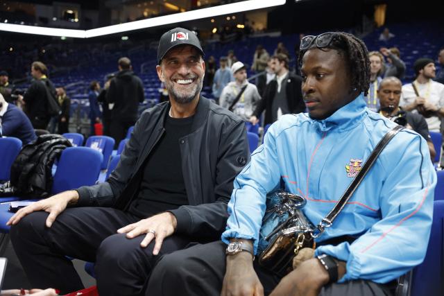 German football coach and global head of Football at Red Bull, Jurgen Klopp (L) attends the 2025/2026 NBA season basketball match between Memphis Grizzlies and Orlando Magic on January 15, 2026 in Berlin. (Photo by Odd ANDERSEN / AFP)