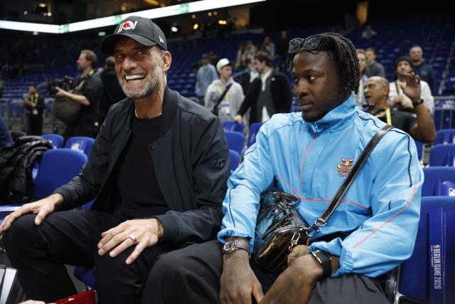 German football coach and global head of Football at Red Bull, Jurgen Klopp (L) attends the 2025/2026 NBA season basketball match between Memphis Grizzlies and Orlando Magic on January 15, 2026 in Berlin. (Photo by Odd ANDERSEN / AFP)