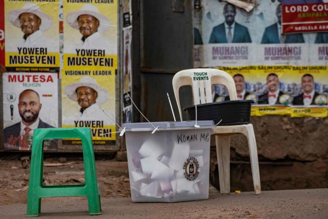 This photograph shows a ballot box on a road closed for a polling station in Kampala on January 15, 2026, during Uganda's 2026 general elections. Polls closed in Uganda on January 15, 2026 after a chaotic day of voting that took place under an internet blackout and with long delays caused by technical breakdowns as President Yoweri Museveni seeks to extend his 40 years in power. Museveni, an 81-year-old who came to power at the head of a rebel army in 1986, is widely expected to win a seventh term in office thanks to his total control of the state and security apparatus. (Photo by BADRU KATUMBA / AFP)