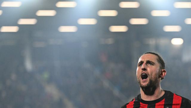 AC Milan's French midfielder #12 Adrien Rabiot celebrates scoring his team's second goal during the Italian Serie A football match between Como and AC Milan at Giuseppe Sinigaglia stadium in Como, on January 15, 2026. (Photo by Stefano RELLANDINI / AFP)