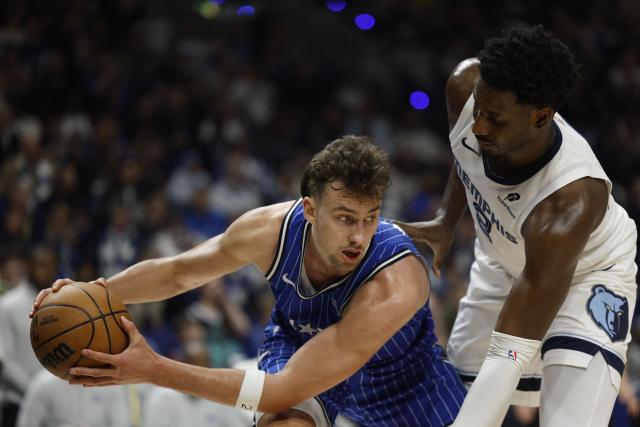 Orlando Magic’s German small forward #22 Franz Wagner and Memphis Grizzlies’ US power forward #08 Jaren Jackson Jr. vie for the ball during the 2025/2026 NBA season basketball match between Memphis Grizzlies and Orlando Magic on January 15, 2026 in Berlin. (Photo by Odd ANDERSEN / AFP)