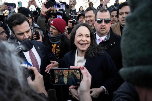 Venezuelan opposition leader Maria Corina Machado speaks to reporters as she departs the US Capitol after meeting with US senators on January 15, 2026 in Washington, DC. US President Donald Trump met earlier Thursday with Venezuelan opposition leader Machado, whose pro-democracy movement he has sidelined since toppling her country's leader, and whose Nobel Peace Prize he openly envies. (Photo by Drew ANGERER / AFP)