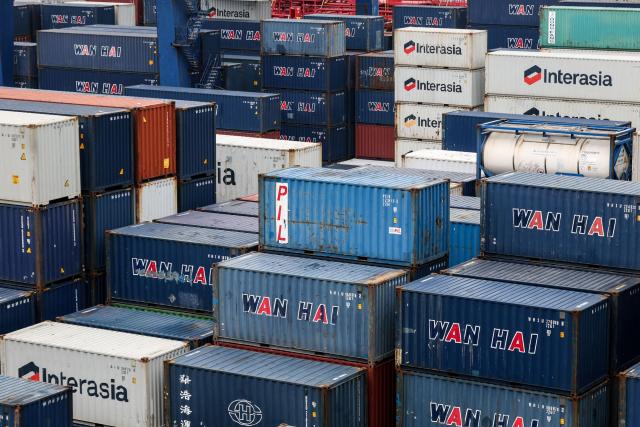 Shipping containers are seen at the port in Keelung on January 16, 2026. The United States said on January 15 that it has signed a deal with Taiwan to reduce tariffs on goods from the democratic island, while increasing Taiwanese semiconductor and tech companies' investments in America. (Photo by I-Hwa Cheng / AFP)