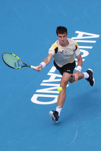 Fabian Marozsan of Hungary hits a return against Jakub Mensik of the Czech Republic during their men's singles semi-final match at the ATP Auckland Classic tennis tournament in Auckland on January 16, 2026. (Photo by Michael Bradley / AFP)
