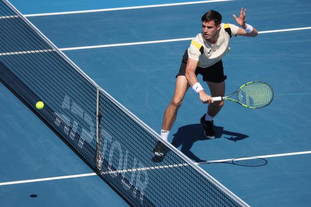 Fabian Marozsan of Hungary hits a return against Jakub Mensik of the Czech Republic during their men's singles semi-final match at the ATP Auckland Classic tennis tournament in Auckland on January 16, 2026. (Photo by Michael Bradley / AFP)