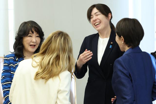 Italy's Prime Minister Georgia Meloni  (back to camera) and Japan's Prime Minister Sanae Takaichi (R) meet with Liberal Democratic Party (LDP) cabinet members Kimi Onoda (C) and Satsuki Katayama for a roundtable with female cabinet members during the Japan-Italy summit meeting in Tokyo on January 16, 2026. (Photo by Takashi Aoyama / POOL / AFP)