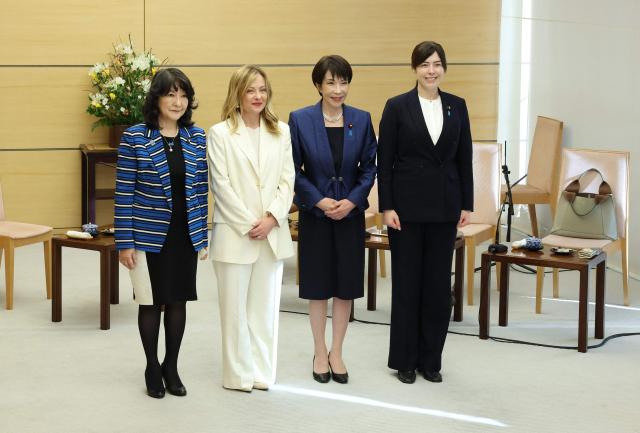 Italy's Prime Minister Georgia Meloni (2nd L) and Japan's Prime Minister Sanae Takaichi (2nd R) pose for a photo with Liberal Democratic Party (LDP) cabinet members Kimi Onoda (R) and Satsuki Katayama before a roundtable with female cabinet members during the Japan-Italy summit meeting in Tokyo on January 16, 2026. (Photo by Takashi Aoyama / POOL / AFP)