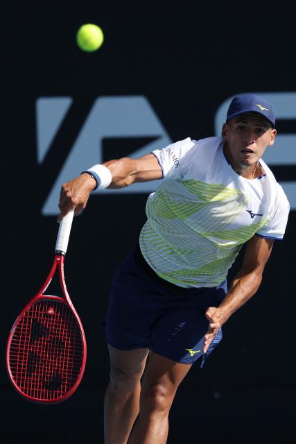 Argentina's Sebastian Baez serves against USA's Marcos Giron during their men's singles semi-final match at the ATP Auckland Classic tennis tournament in Auckland on January 16, 2026. (Photo by Michael Bradley / AFP)