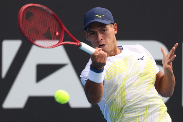 Argentina's Sebastian Baez hits a return against USA's Marcos Giron during their men's singles semi-final match at the ATP Auckland Classic tennis tournament in Auckland on January 16, 2026. (Photo by Michael Bradley / AFP)