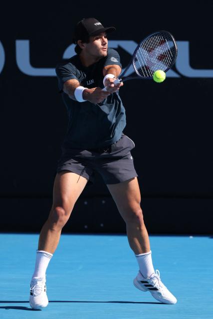 USA's Marcos Giron hits a return against Argentina's Sebastian Baez during their men's singles semi-final match at the ATP Auckland Classic tennis tournament in Auckland on January 16, 2026. (Photo by Michael Bradley / AFP)
