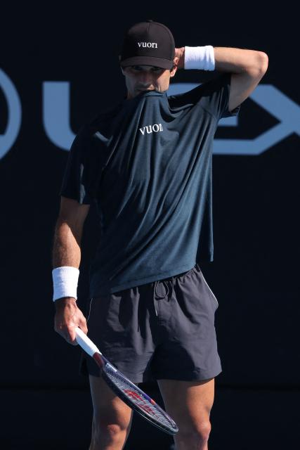 USA's Marcos Giron reacts after a point against Argentina's Sebastian Baez during their men's singles semi-final match at the ATP Auckland Classic tennis tournament in Auckland on January 16, 2026. (Photo by Michael Bradley / AFP)