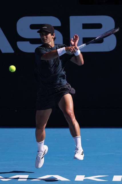 USA's Marcos Giron hits a return against Argentina's Sebastian Baez during their men's singles semi-final match at the ATP Auckland Classic tennis tournament in Auckland on January 16, 2026. (Photo by Michael Bradley / AFP)