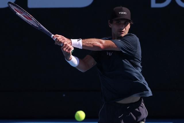 USA's Marcos Giron hits a return against Argentina's Sebastian Baez during their men's singles semi-final match at the ATP Auckland Classic tennis tournament in Auckland on January 16, 2026. (Photo by Michael Bradley / AFP)