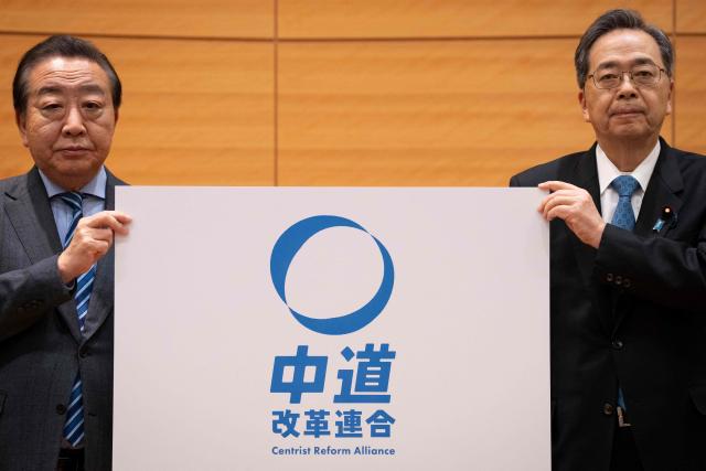 Leader of the Constitutional Democratic Party of Japan (CDP) Yoshihiko Noda (L) and Komeito leader Tetsuo Saito pose during a joint press conference to announce the new party name 'Centrist Reform Alliance' in Tokyo on January 16, 2026. (Photo by Yuichi YAMAZAKI / AFP)