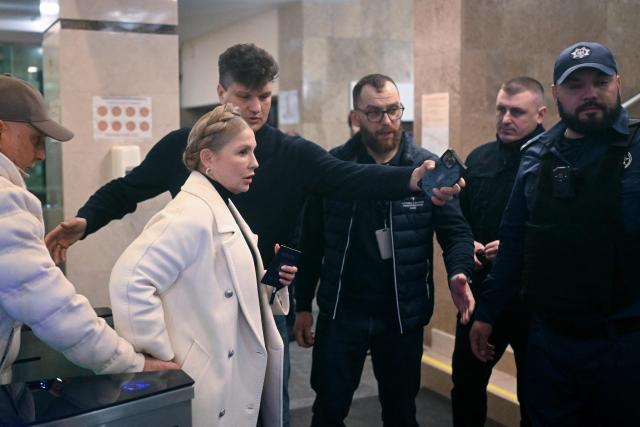 Former Ukraine's Prime Minister Yulia Tymoshenko accompanied by her husband Oleksandr arrives for a pre-trial hearing at a court in Kyiv on January 16, 2026, amid the Russian invasion of Ukraine. Former Ukraine's Prime Minister Yulia Tymoshenko said on January 14, 2026 her party's office had been raided overnight after anti-corruption bodies announced a sweeping probe into political corruption. (Photo by Sergei GAPON / AFP)