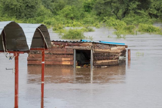 A general view of an informal structure submerged in floodwater in Giyani on January 16, 2026. Flooding triggered by torrential rains in northeastern South Africa claimed at least 10 lives overnight and forced the closure of the iconic Kruger National Park, officials said on January 15, 2026. 
The weather service issued the maximum warning for more rain in parts of the country while neighbouring Mozambique was also on alert after flooding that inundated roads and homes. (Photo by Orlando Chauke / AFP)