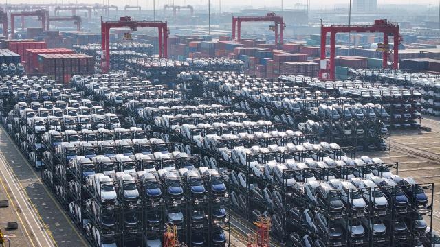 (FILES) BYD electric cars waiting to be loaded onto a ship are seen stacked at the international container terminal of Taicang Port in Suzhou, in China’s eastern Jiangsu province on February 8, 2024. Canada will allow 49,000 Chinese electric vehicles to be imported under new, preferential tariff rates, Prime Minister Mark Carney said on January 16, 2026 after reaching a trade deal with China's leader Xi Jinping in Beijing. (Photo by AFP) / China OUT