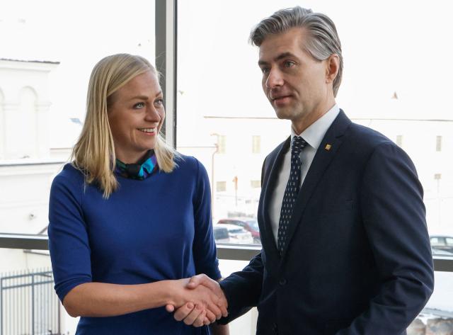 Finnish Foreign Minister Elina Valtonen and Lithuanian Foreign Minister Kestutis Budrys shake hands as he greets her prior to the traditional Snow Meeting Vilnius, Lithuania, on January 16, 2026. Vilnius hosts the traditional Snow Meeting, which will bring together foreign and security policy experts to discuss relevant topics on the political agenda. (Photo by Petras Malukas / AFP)