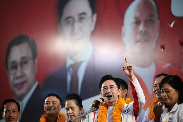 Pheu Thai Party’s prime ministerial candidate Yodchanan Wongsawat (centre R) speaks on stage with fellow party members and MP candidates during a Pheu Thai Party rally ahead of the general election in Samut Prakan on January 16, 2026. (Photo by Lillian SUWANRUMPHA / AFP)