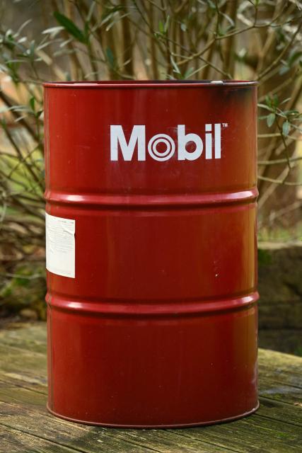 This photograph shows an oil barrel with the branding of US oil giant Exxon Mobil in Itxassou, south-western France on January 16, 2026. The US Department of Energy has unveiled a plan to develop Venezuela's oil industry and has begun marketing Venezuelan crude,with US oil executives meeting with US President Donald Trump ahead of which he pledged to invest $100 billion to revive Venezuela's oil sector. (Photo by Gaizka IROZ / AFP)