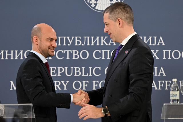 French Foreign Minister Jean-Noel Barrot (L) shakes hands with his Serbian counterpart Marko Djuric during a joint press conference in Belgrade on January 16, 2026. (Photo by Andrej ISAKOVIC / AFP)