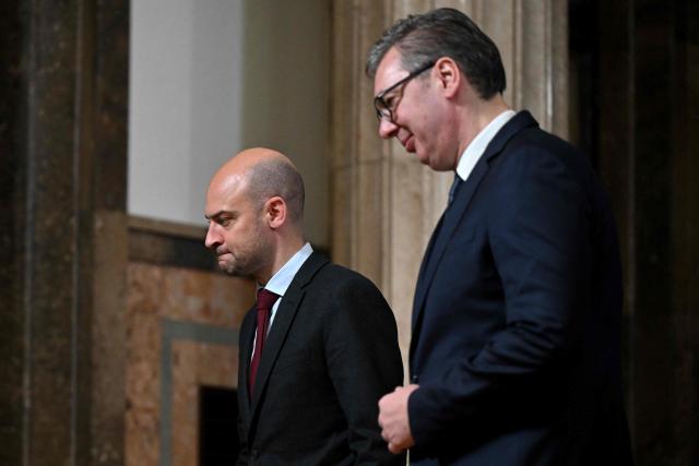 French foreign minister Jean-Noel Barrot (L) and Serbian President Aleksandar Vucic leave after a documents signing ceremony in Belgrade on January 16, 2026. (Photo by Andrej ISAKOVIC / AFP)