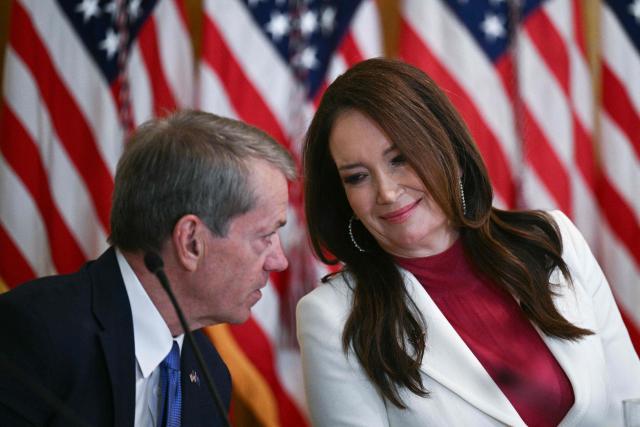 (L/R) Nebraska Governor Jim Pillen and US Secretary of Agriculture Brooke Rollins speak with each other during a roundtable discussion hosted by US President Donald Trump on rural health care investments in the East Room of the White House in Washington, DC on January 16, 2026. (Photo by Brendan SMIALOWSKI / AFP)